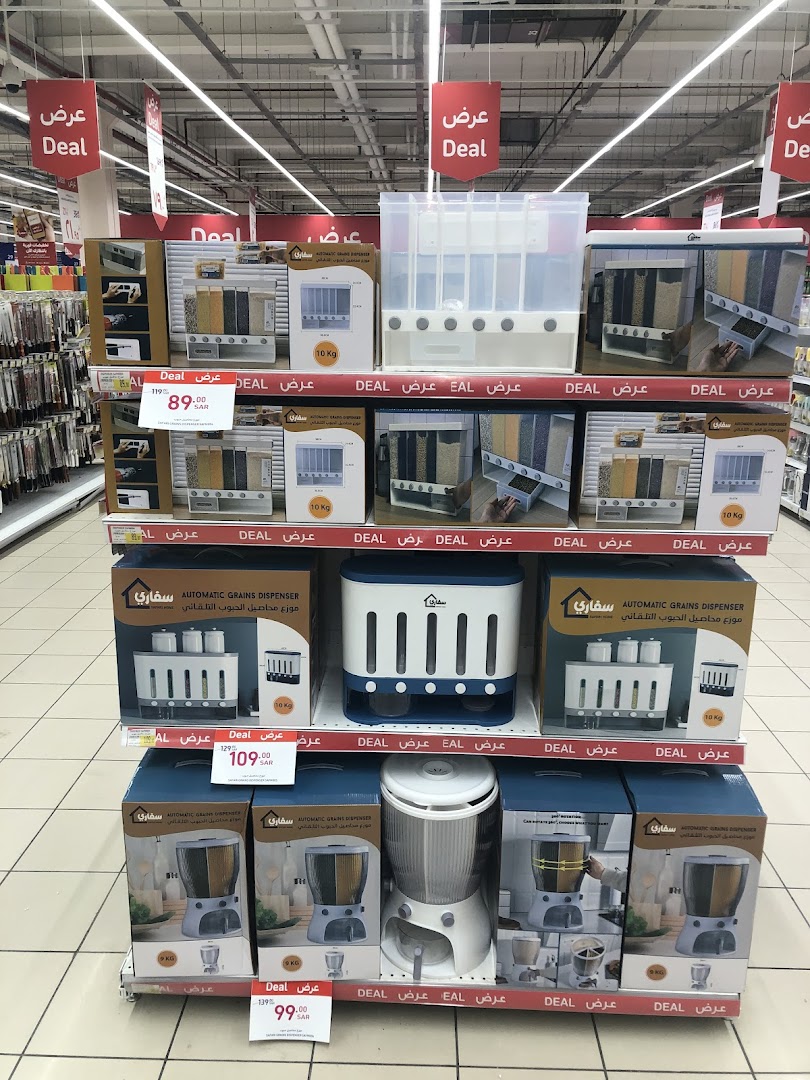 Shelves stocked with automatic grain dispensers and other kitchenware, with 'Deal' signs.