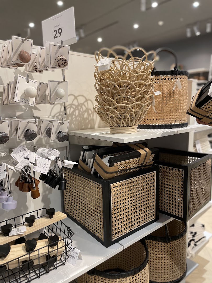 A display of various home decor items, including decorative baskets and drawer knobs.