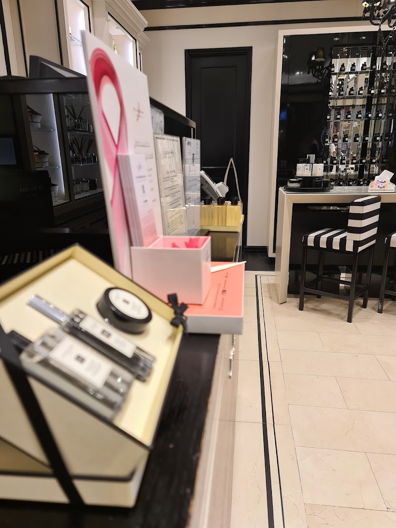 Interior view of a Jo Malone shop showcasing perfumes and gift sets.