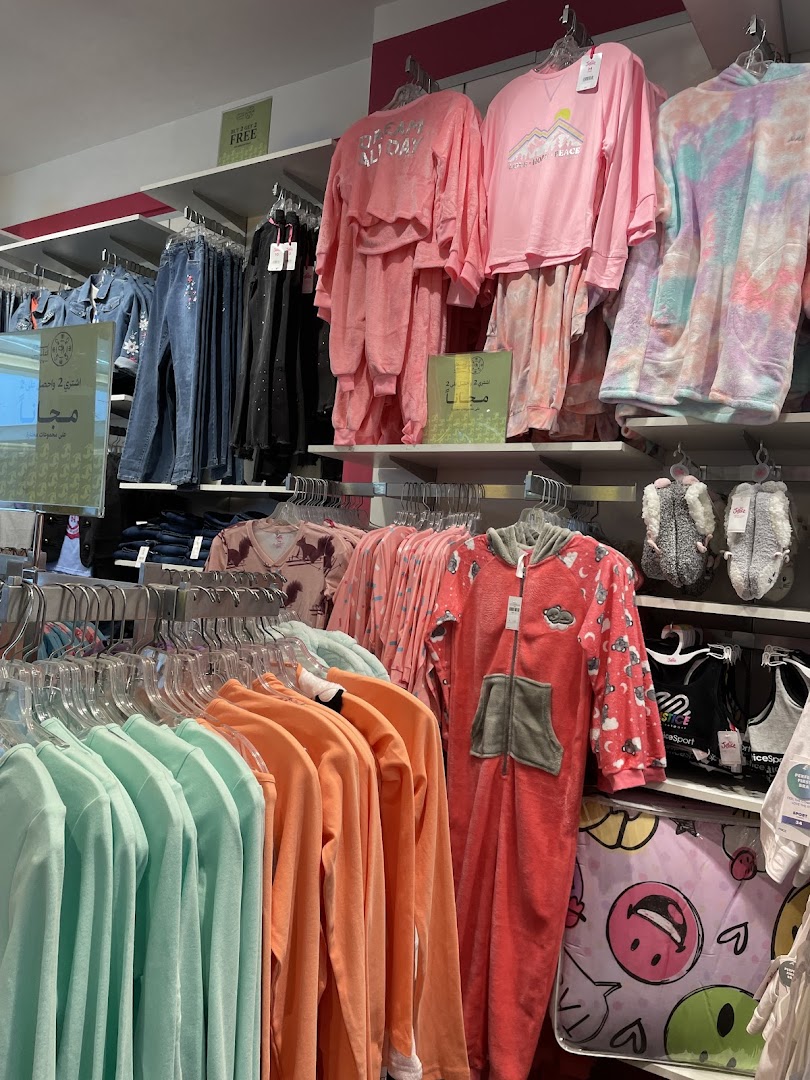 A display of colorful pajamas and loungewear for girls at Justice.