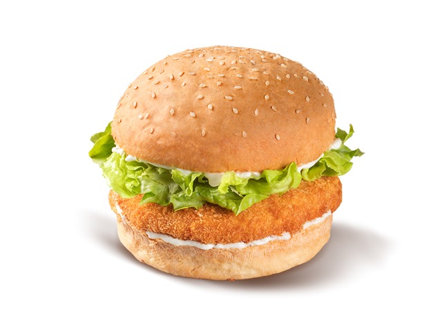 A delicious chicken burger with lettuce and sauce on a sesame seed bun.
