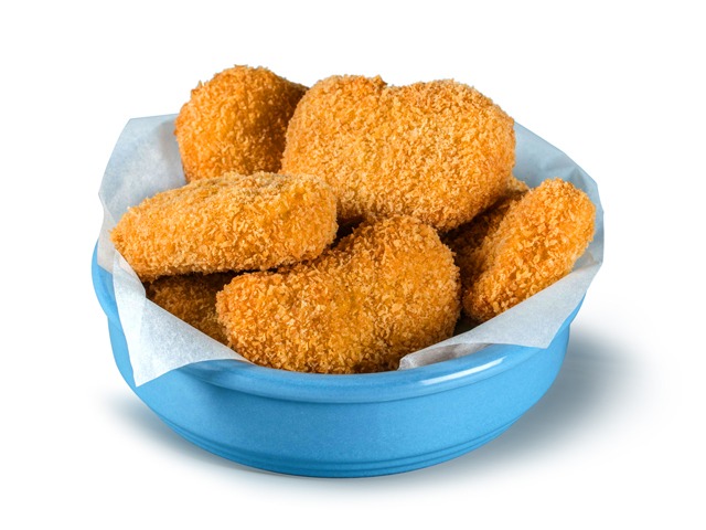 A blue bowl filled with golden-brown, crispy chicken nuggets on white parchment paper.