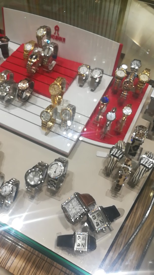A display case filled with a variety of luxury watches, featuring different styles and materials.