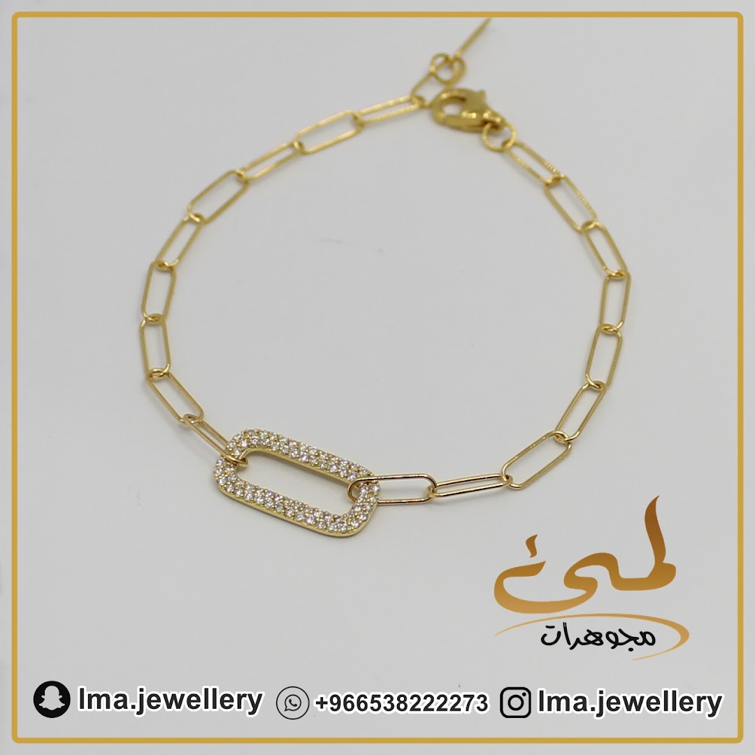 A close-up shot of a gold bracelet with diamond-encrusted links.
