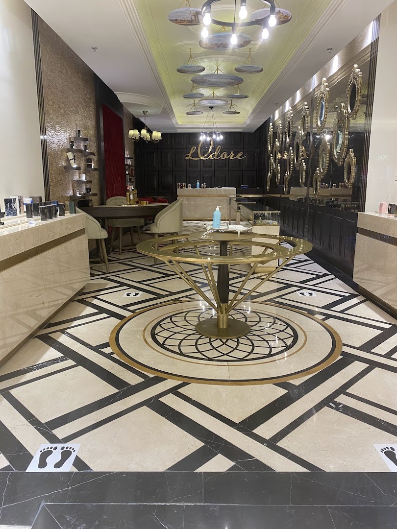 Interior view of a luxurious shop with elegant decor and display shelves.