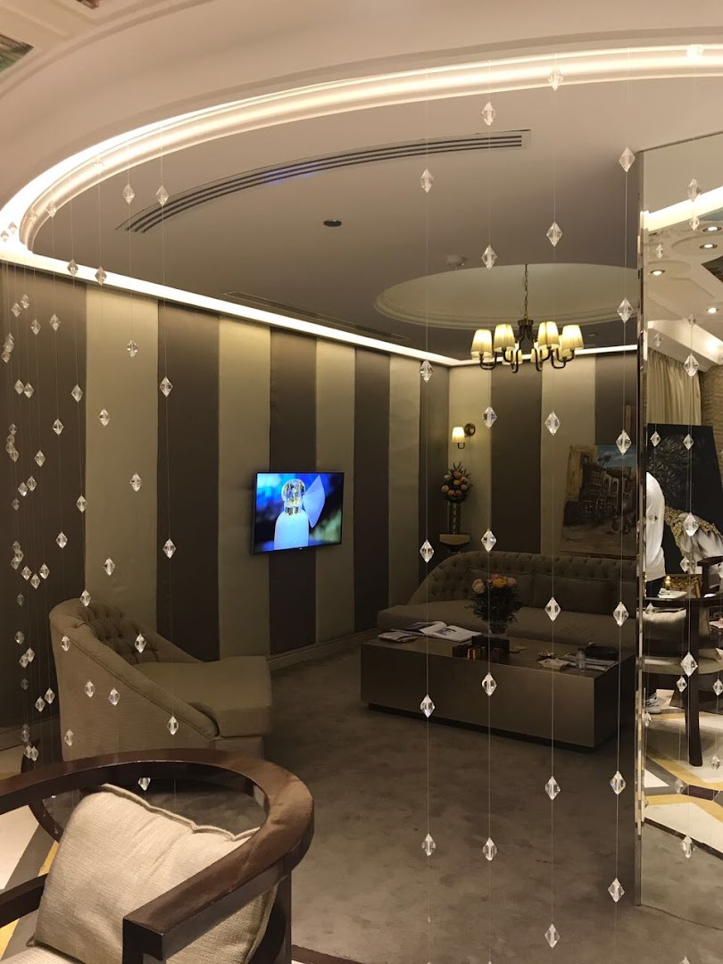 Elegant lounge area with plush seating, crystal decor, and a modern chandelier.