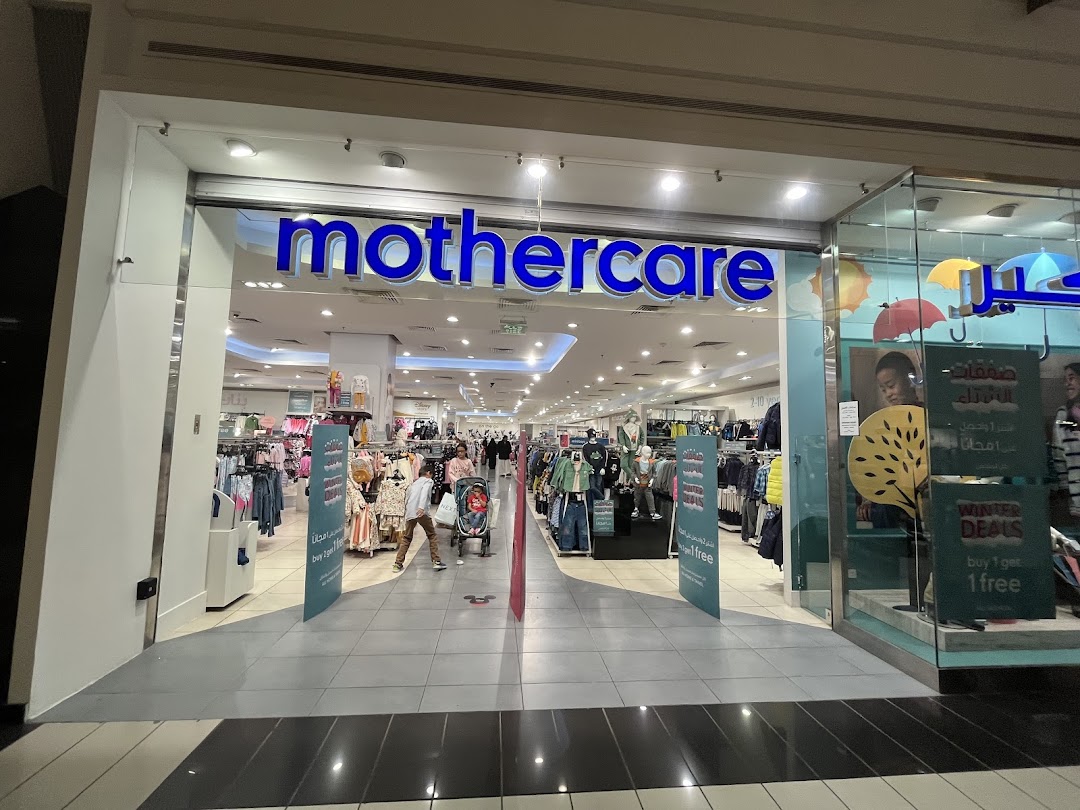 The entrance to a Mothercare store, showcasing children's clothing and winter deals.
