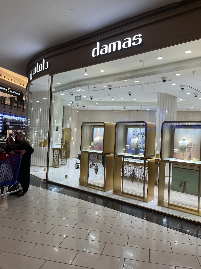 A well-lit jewelry store with elegant displays of necklaces and jewelry.