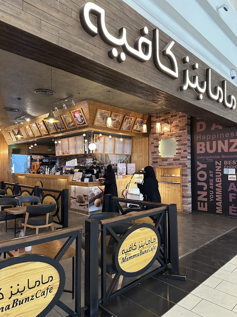 The inviting entrance of MammaBunz Cafe with its warm wooden interior and clear signage.