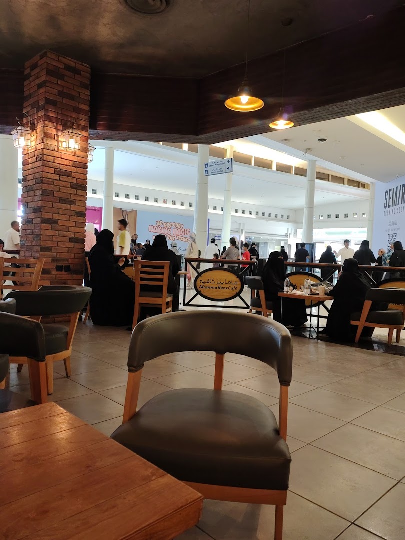 Interior view of MammaBunz Cafe with seating and patrons in a mall.