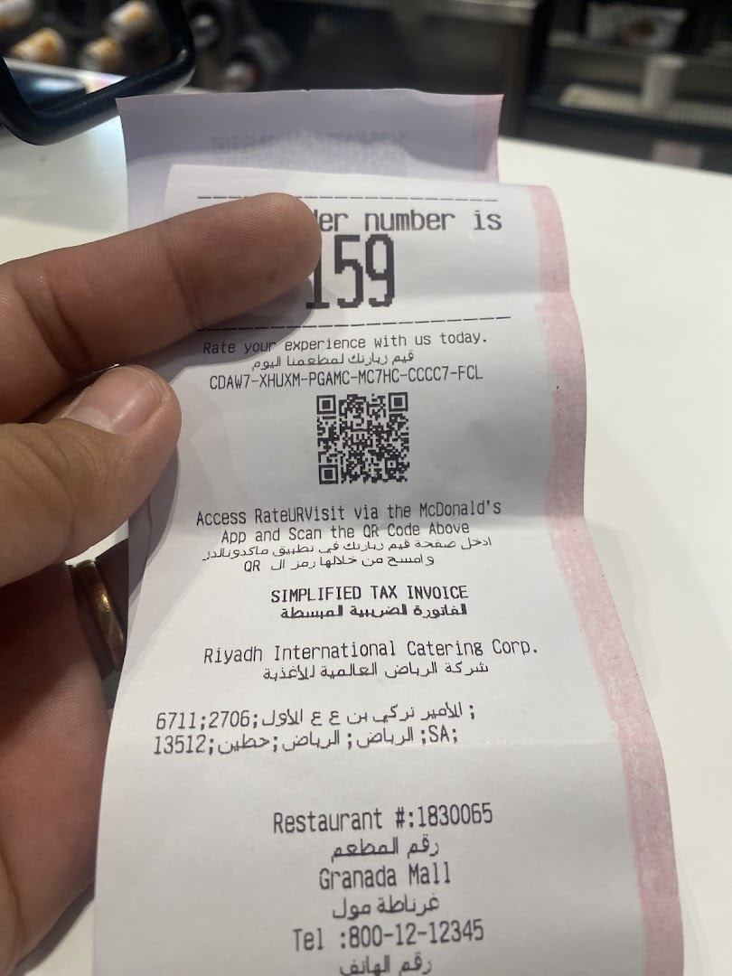 A receipt from McDonald's with order number 159 and a QR code.