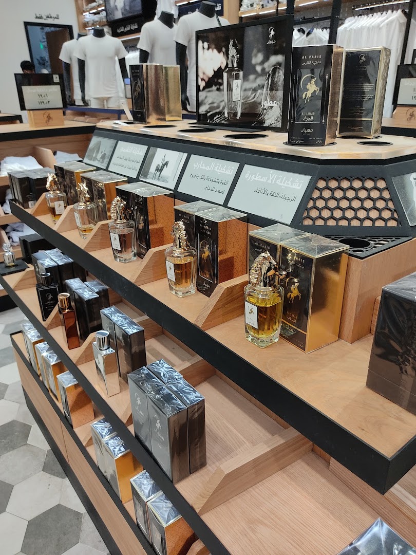 A display of luxury perfumes in elegant gold and silver packaging at Mihyar.