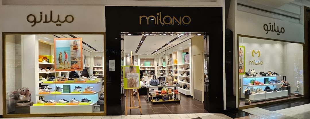 The Milano shoe and handbag store features a well-lit interior with shoes and bags displayed on shelves.