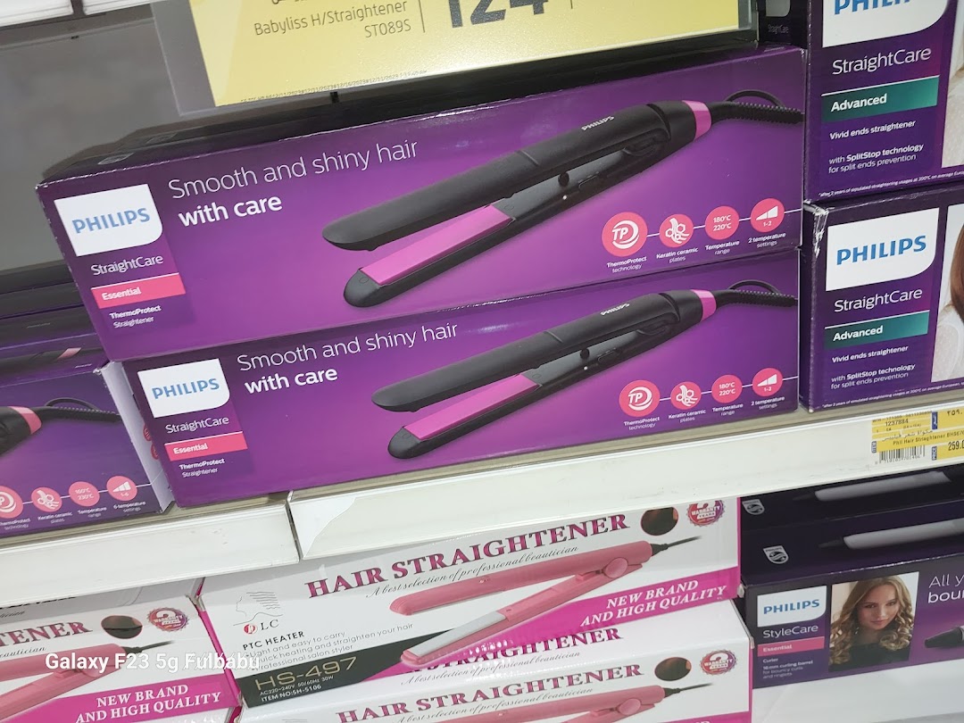 Shelves stocked with Philips hair straighteners and other hair styling products.