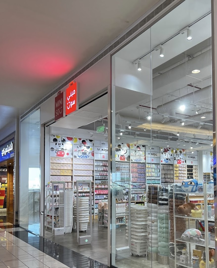 The entrance of a MINISO store, showcasing a wide variety of colorful products and merchandise.