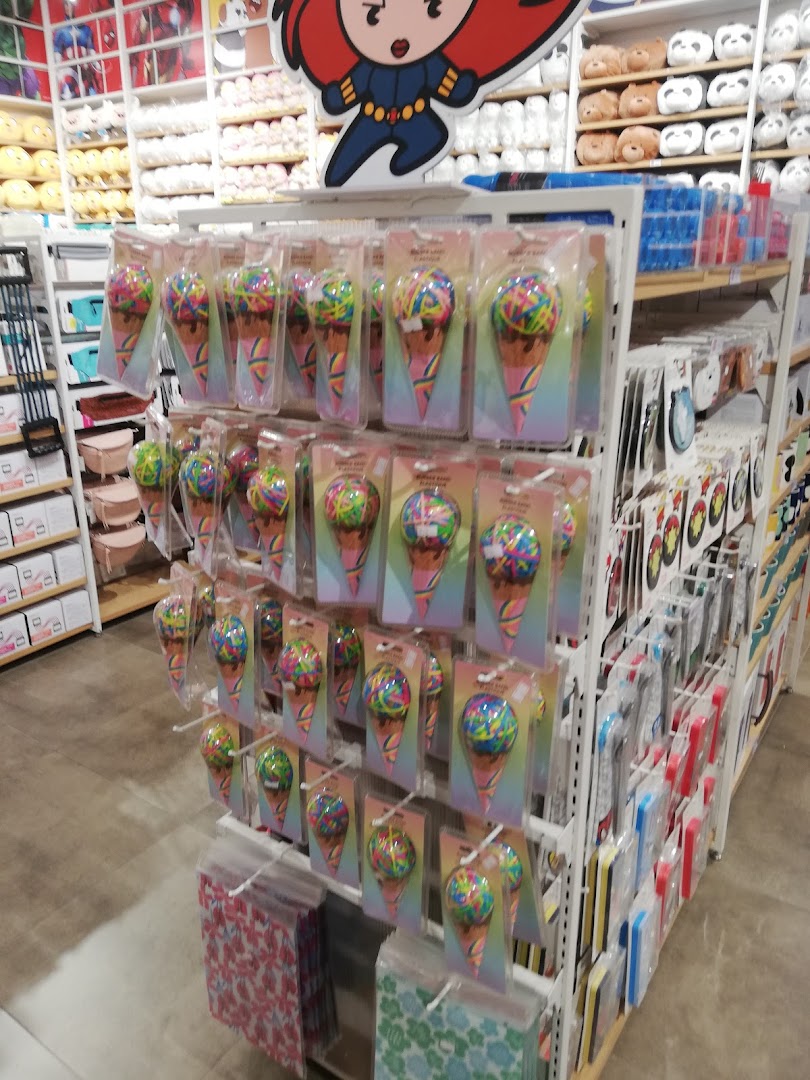 A retail store interior displaying shelves filled with colorful novelty items, including ice cream cone-shaped stress balls.