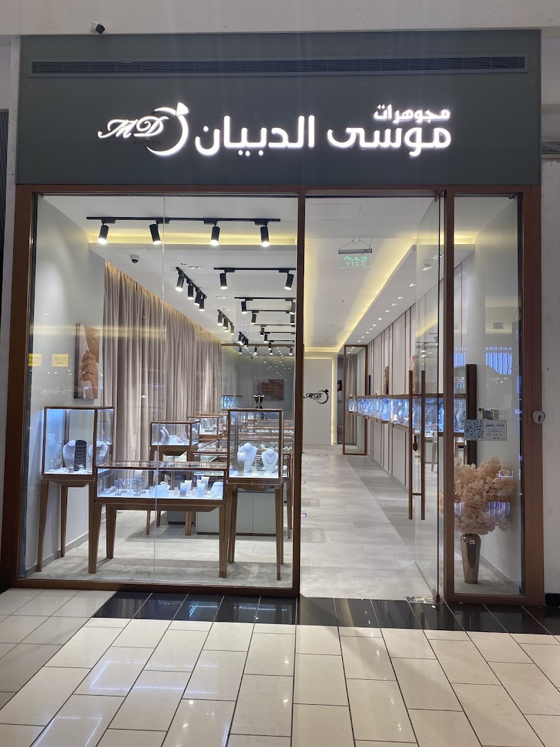 The exterior of a jewelry store with display cases showcasing necklaces and jewelry.