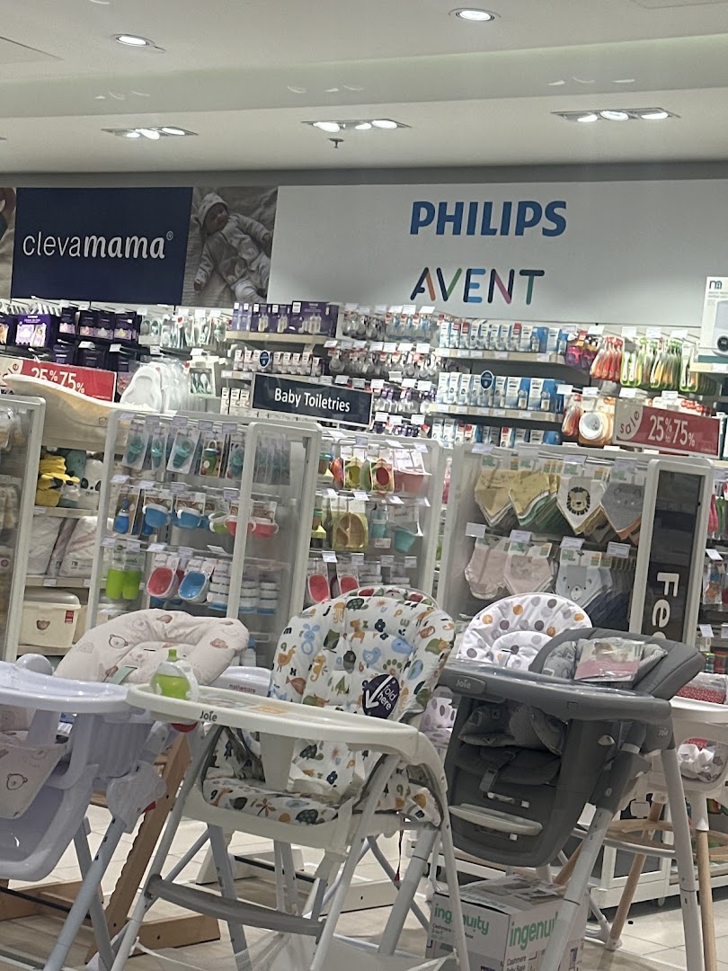 Interior view of a Mothercare store showcasing baby products like high chairs and toiletries.