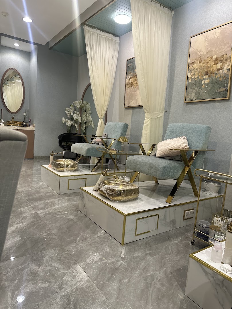 Luxurious spa interior with comfortable seating and pedicure stations.