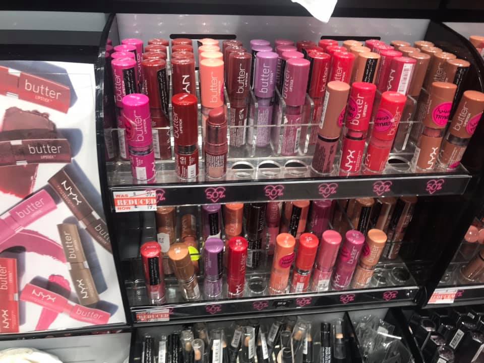A display of NYX Butter Lipstick in various shades, with some items marked as reduced.
