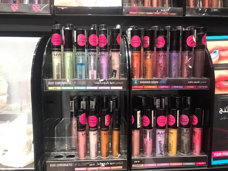 A display of NYX lip glosses and lip veils in various shades and finishes.
