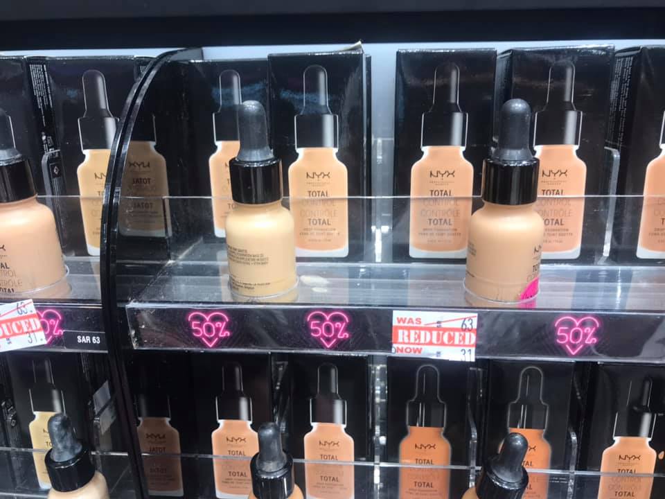 NYX Total Control Drop Foundation bottles displayed with 50% off sale signs.