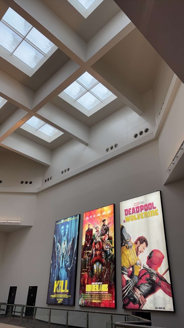 Movie posters for Kill, Borderlands, and Deadpool & Wolverine displayed in a cinema lobby.