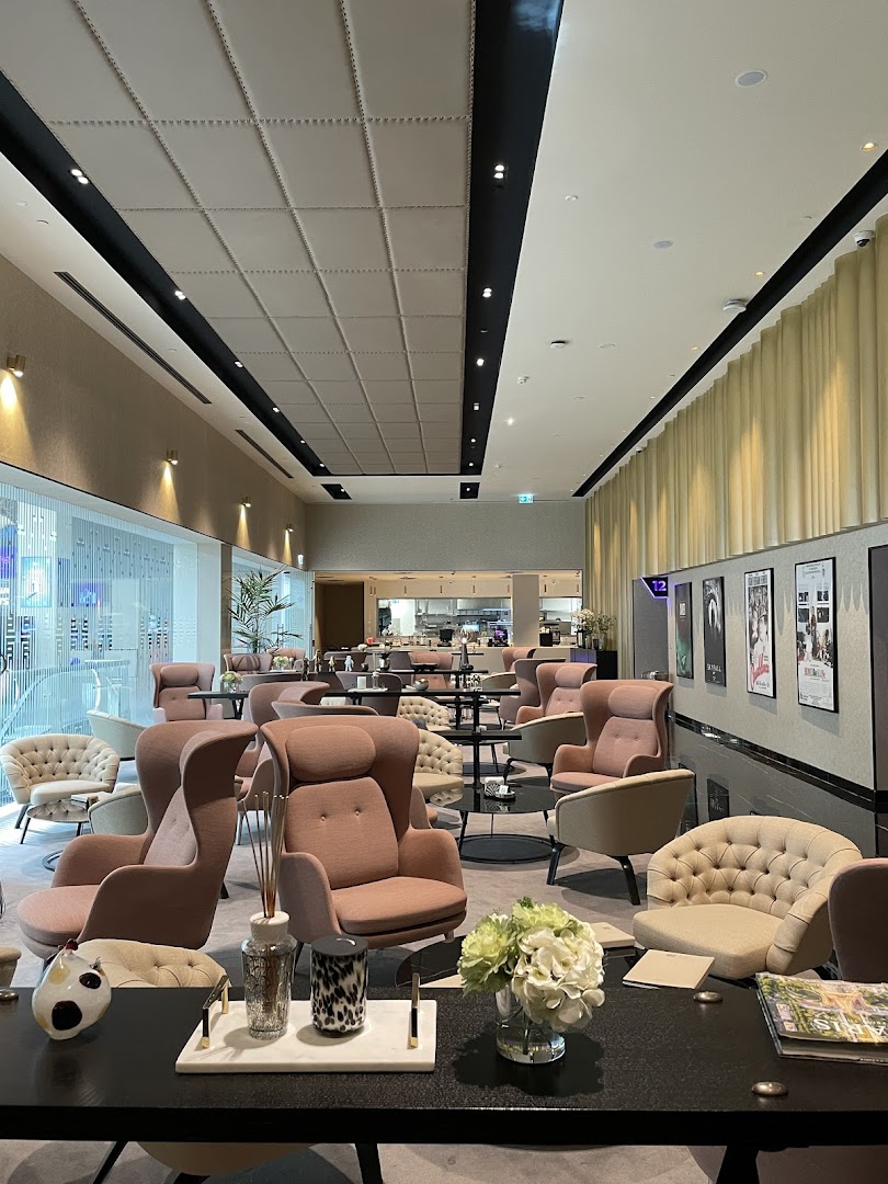 A stylish lounge area with comfortable seating and decorative elements.
