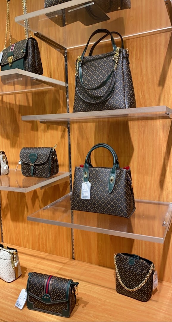 A display of stylish handbags and shoes from Saga, showcasing elegant designs and quality craftsmanship.