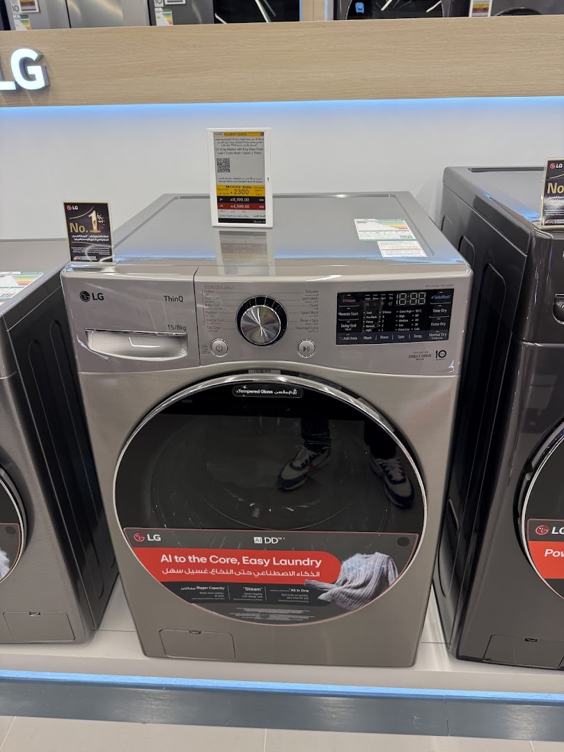 LG washing machine with AI DD technology and easy laundry features on display.