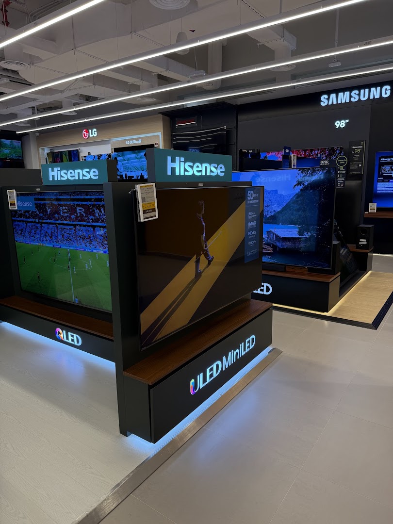 A display of various televisions, including Hisense, LG, and Samsung brands, showcasing different technologies like QLED and ULED MiniLED.
