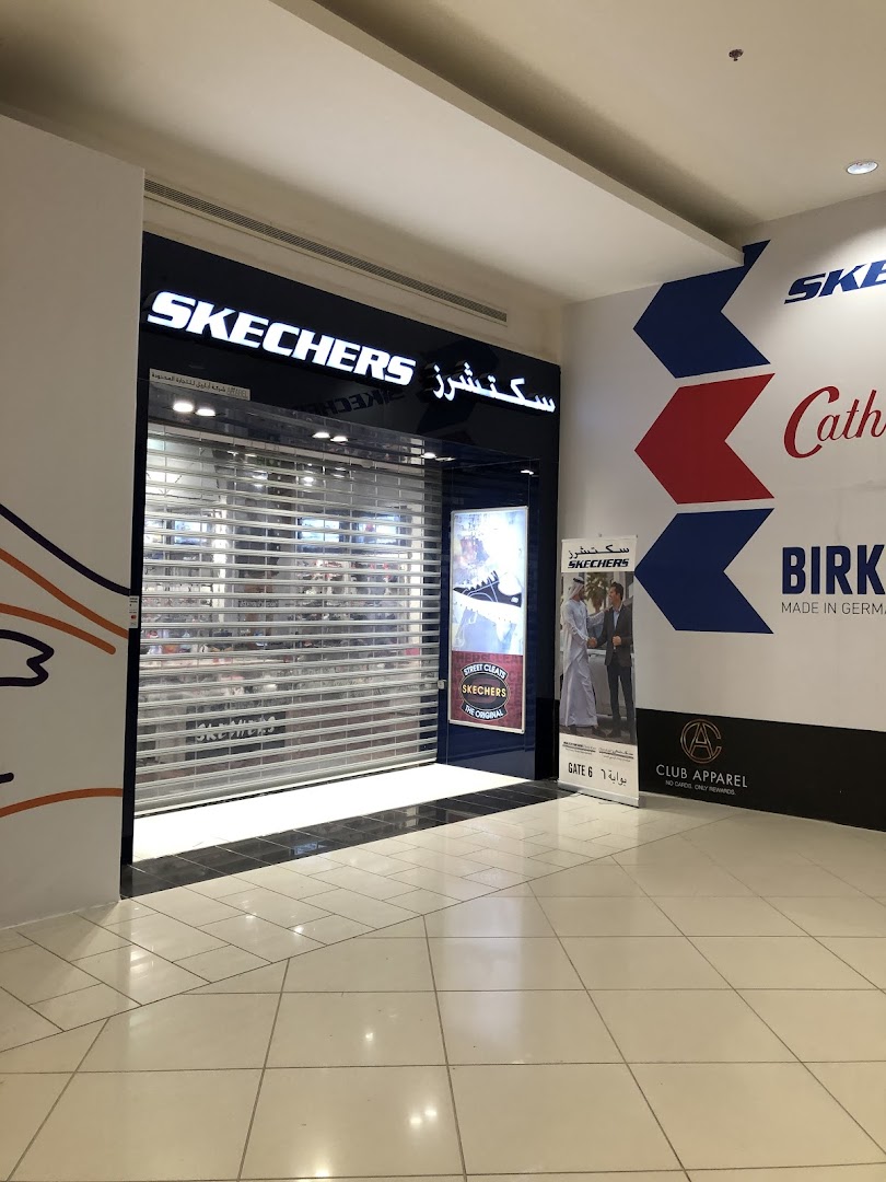 The Skechers store entrance with its roller shutter down, displaying the brand's signage.
