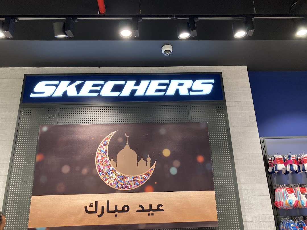 Skechers store with illuminated logo and Eid Mubarak decoration.