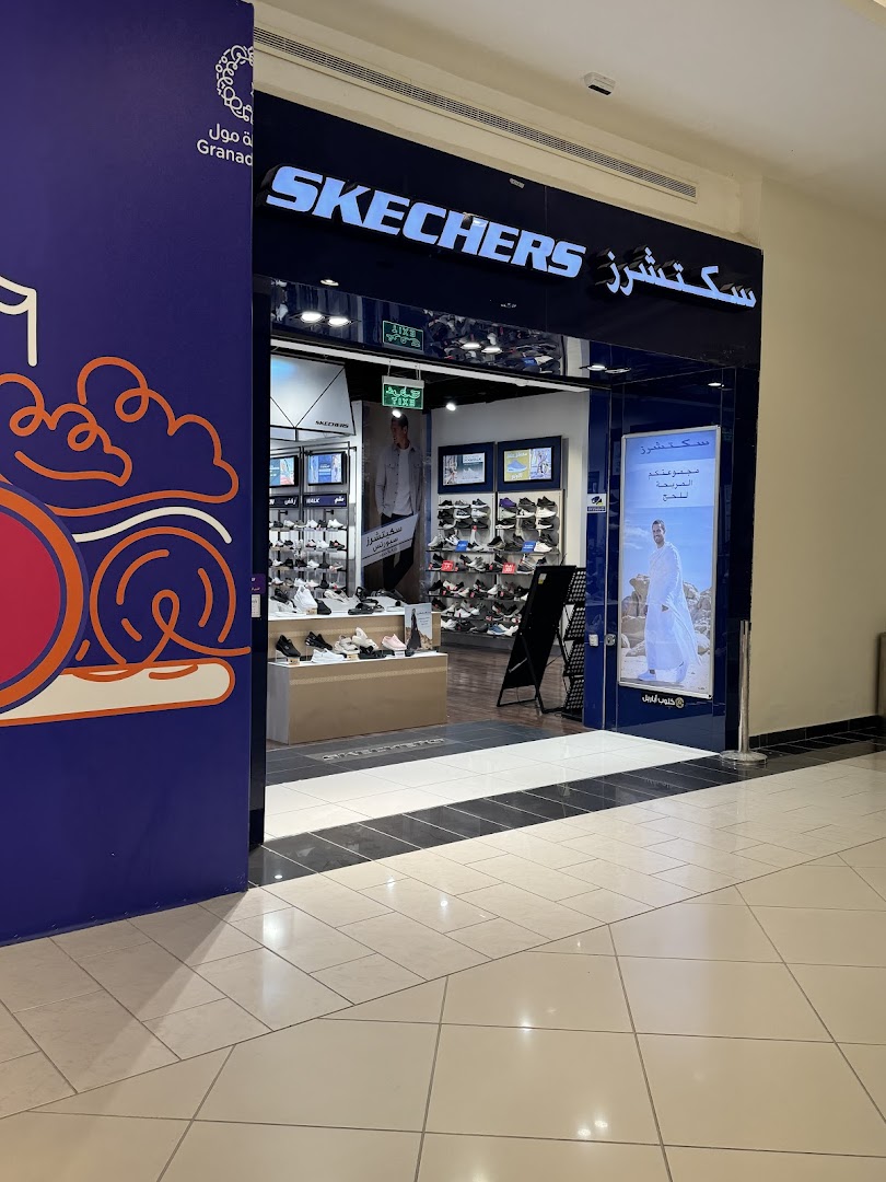 The Skechers store entrance at Granada Mall, showcasing various footwear displays.