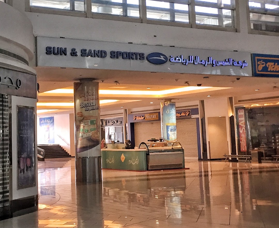 The Sun & Sand Sports shop front with its prominent signage in a mall.
