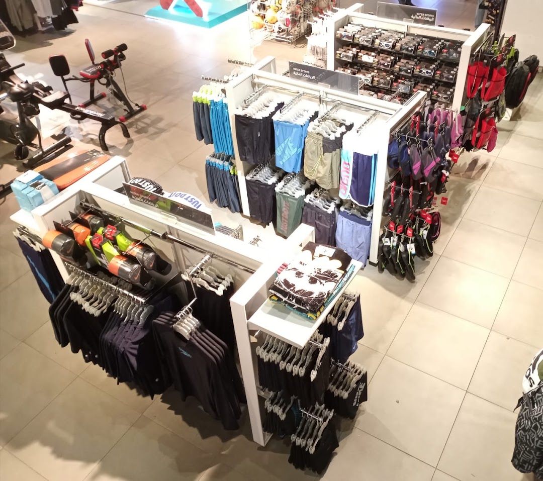 Interior view of a sports apparel and equipment store, showcasing activewear and fitness gear.