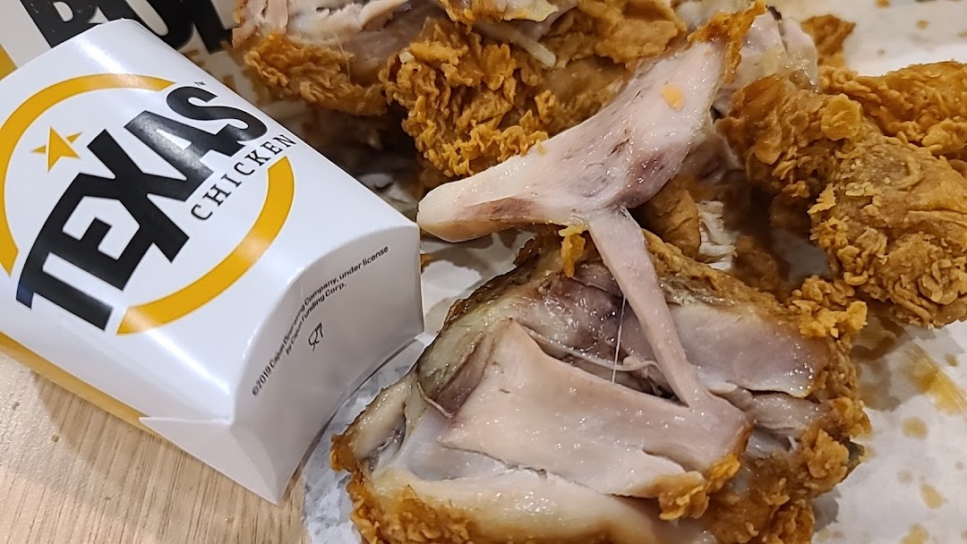 Juicy, crispy fried chicken pieces with a Texas Chicken branded container.