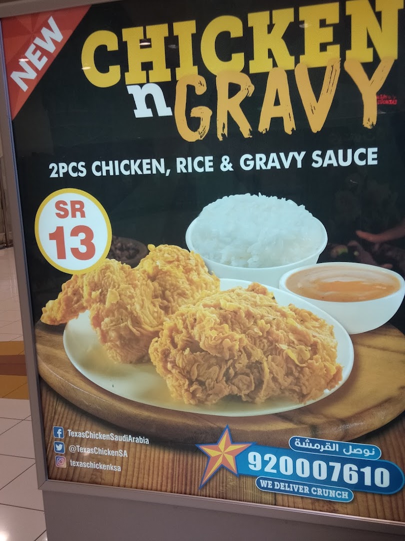 A promotional sign for Texas Chicken's 'Chicken n Gravy' meal, featuring fried chicken, rice, and gravy.
