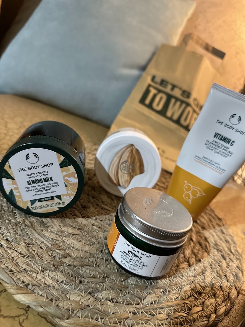 The Body Shop products including body yogurt, cleansing polish, and moisturizer.