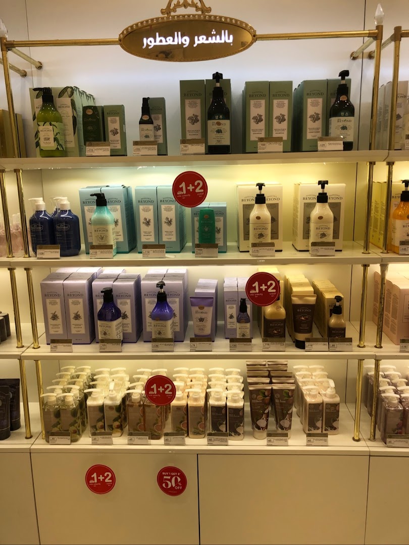 Shelves filled with various hair and body care products from THE FACE SHOP.