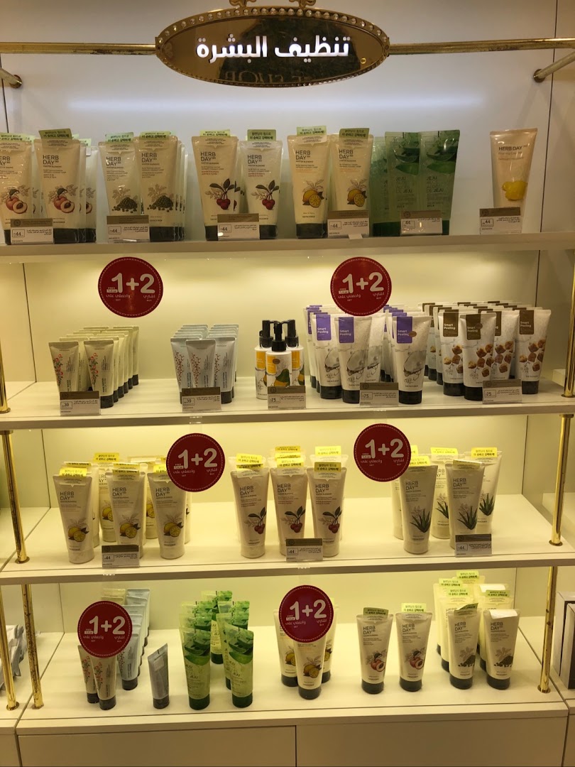 Shelves filled with various skincare products, primarily facial cleansers and masks, from THE FACE SHOP.