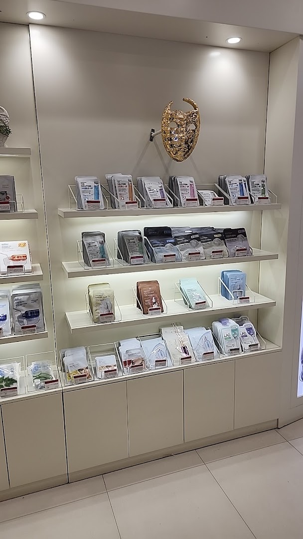 Shelves stocked with various skincare products, including sheet masks, at THE FACE SHOP.