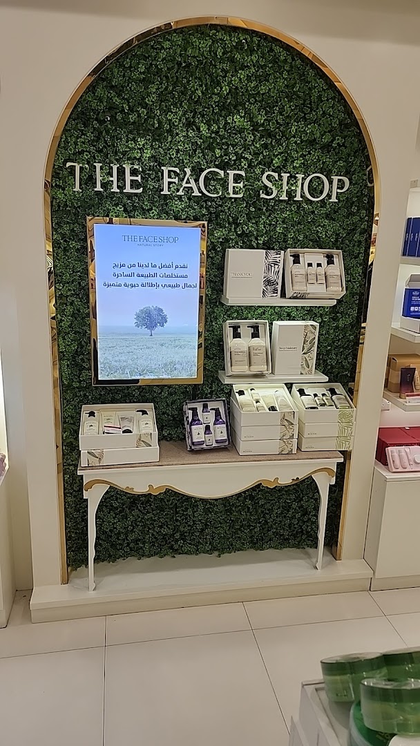 The Face Shop display featuring skincare sets and a nature-themed advertisement.
