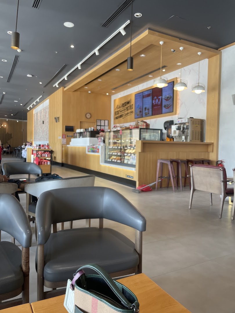 Interior view of a Tim Hortons coffee shop with seating and counter.