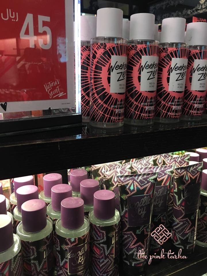 Victoria's Secret body mists and lotions displayed on shelves with price tags.