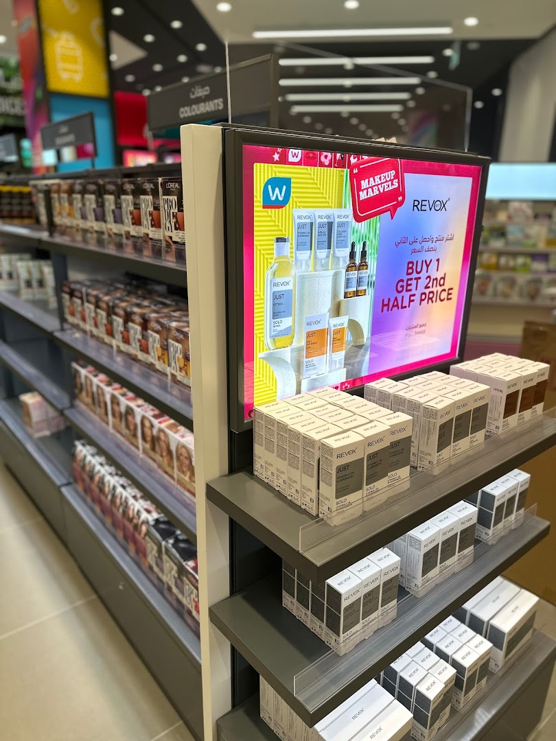 Watsons store interior showcasing shelves stocked with beauty products and a promotional display.