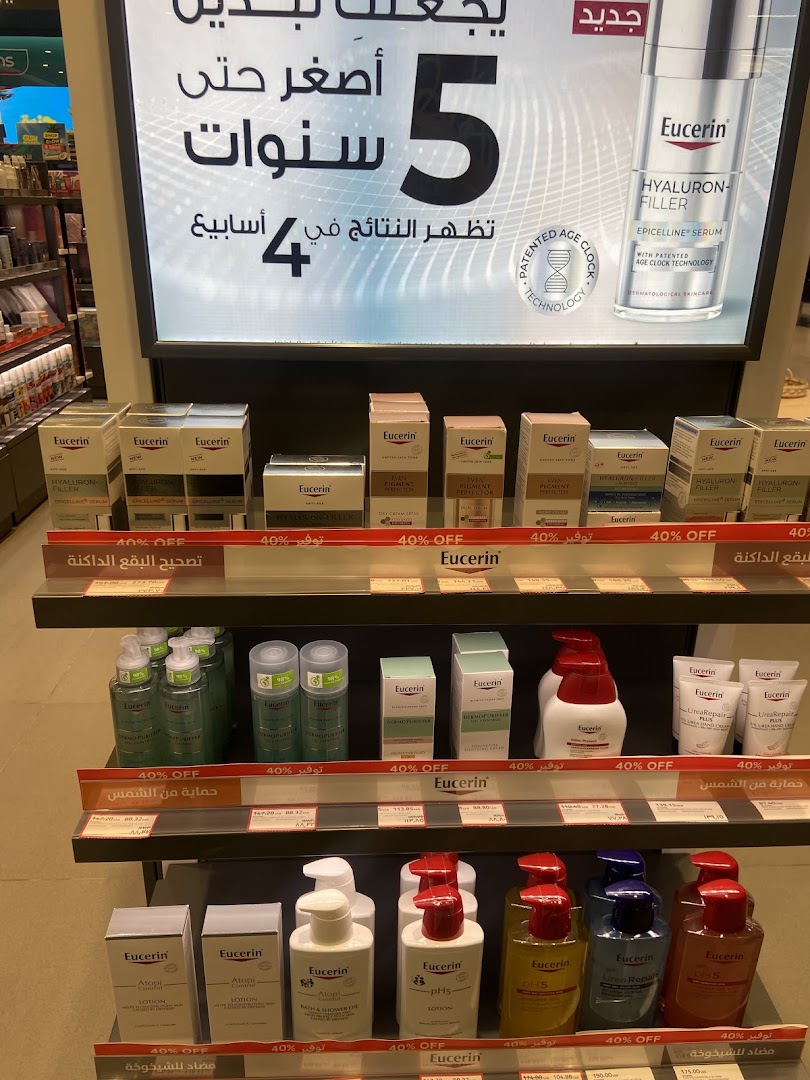 A display of Eucerin skincare products, featuring anti-aging and sun protection lines with promotional signage.