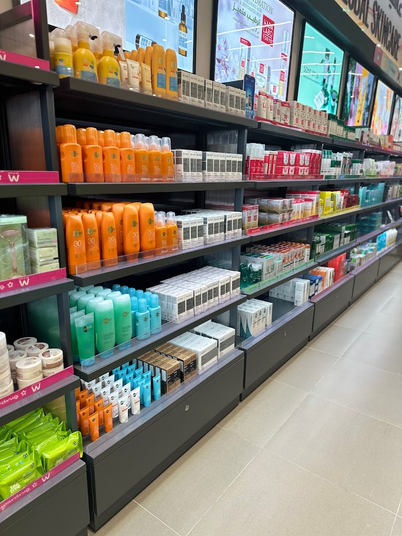 A wide aisle in a Watsons store showcasing shelves filled with skincare and beauty products.