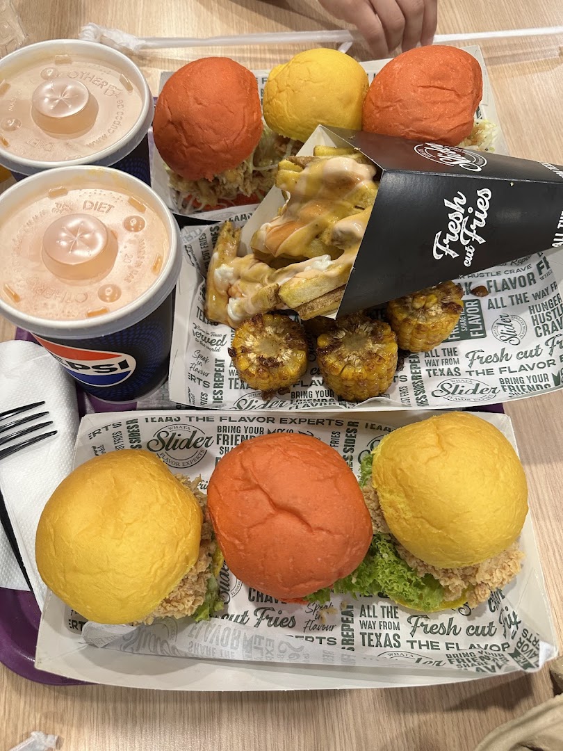 A tray of colorful sliders, fries, and drinks from WhatASlider.