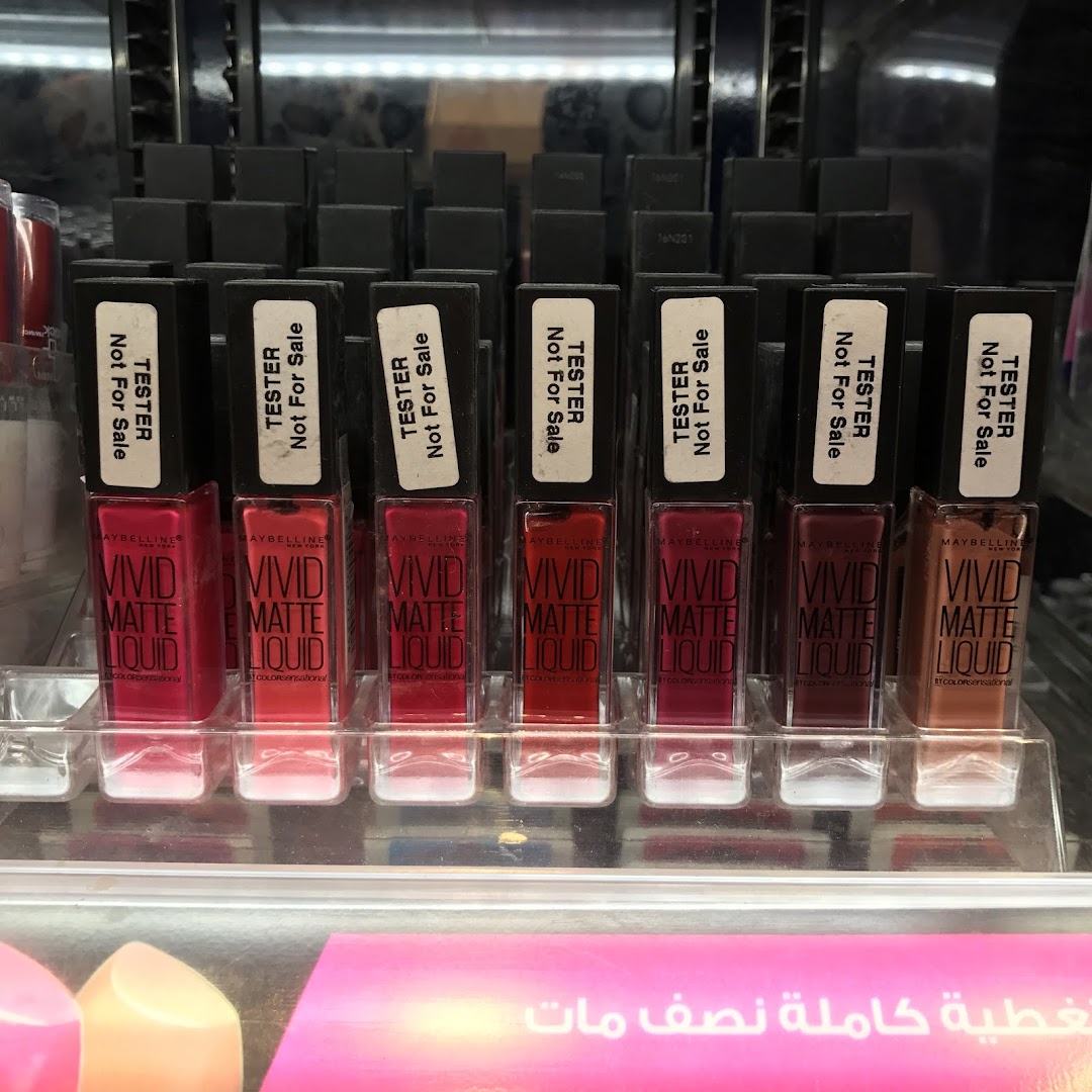 A display of Maybelline Vivid Matte Liquid lipstick testers in various shades.